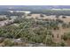 Aerial view of the property highlighting the treed surroundings and the house with white perimeter line at 2045 Marion County Rd, Weirsdale, FL 32195