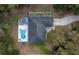 An aerial view shows a backyard pool and a large area for outdoor entertaining at 2045 Marion County Rd, Weirsdale, FL 32195