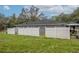 Fenced backyard with lush green grass providing security and privacy for outdoor enjoyment at 2045 Marion County Rd, Weirsdale, FL 32195