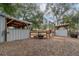 Horse stall, open barn and fenced area featuring a horse in the stall at 2045 Marion County Rd, Weirsdale, FL 32195