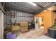 Barn interior with metal walls and roof; includes storage room and stacked hay at 2045 Marion County Rd, Weirsdale, FL 32195