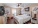 Cozy bedroom with horse-themed decor, wood floors, and ample natural light at 2045 Marion County Rd, Weirsdale, FL 32195