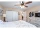 Bedroom featuring a ceiling fan, a dresser, and a closet at 2045 Marion County Rd, Weirsdale, FL 32195