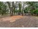 Driveway leading to horse facilities with lush trees and plenty of land at 2045 Marion County Rd, Weirsdale, FL 32195