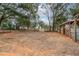 Equestrian property featuring open paddock, wooden fencing, and horse shelter with gate at 2045 Marion County Rd, Weirsdale, FL 32195