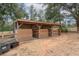 View of horse shelter featuring 3 bays with individual gated stalls at 2045 Marion County Rd, Weirsdale, FL 32195