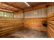 Inside view of wooden horse stall with a metal roof at 2045 Marion County Rd, Weirsdale, FL 32195