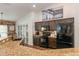 Modern kitchen featuring granite countertops, black appliances and dark brown cabinets at 2045 Marion County Rd, Weirsdale, FL 32195