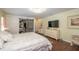 Bright and airy main bedroom featuring wood floors, a barn door, and ample closet space at 2045 Marion County Rd, Weirsdale, FL 32195