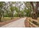 Scenic path winding through a lush wooded area, providing a tranquil walking experience at 2045 Marion County Rd, Weirsdale, FL 32195