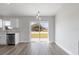 Modern kitchen and dining area with stainless steel appliances and sliding glass door at 2686 Sw 144Th Ct, Ocala, FL 34481