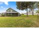 Expansive backyard showcasing the home's rear exterior and ample green space at 2840 Se 35Th St, Ocala, FL 34471