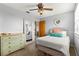 Bedroom featuring a ceiling fan, large mirror, and closet at 2840 Se 35Th St, Ocala, FL 34471