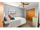 Bedroom featuring a ceiling fan, window, and closet at 2840 Se 35Th St, Ocala, FL 34471