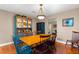 Bright dining area with a wooden table, colorful chairs, and a classic china cabinet at 2840 Se 35Th St, Ocala, FL 34471