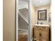 Powder room featuring white vanity, mirror, and tile flooring at 2840 Se 35Th St, Ocala, FL 34471