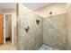 Walk-in shower featuring a tiled surround, niche, and shower head at 2840 Se 35Th St, Ocala, FL 34471