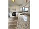 Close-up of kitchen with stainless steel appliances, granite countertops, and a view from the window at 301 Oak Track Way, Ocala, FL 34472