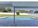 Relaxing backyard pool area with a covered patio and scenic views of lush greenery at 3853 Se 60Th St, Ocala, FL 34480