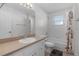 Cozy bathroom with neutral decor featuring a shower-tub combo and functional vanity area at 3853 Se 60Th St, Ocala, FL 34480