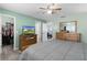 Bedroom with a view of the closet, a wooden dresser with TV, and an adjoining dining area at 3853 Se 60Th St, Ocala, FL 34480