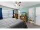 Bedroom with a large window and neutral walls leading to a closet and private bathroom at 3853 Se 60Th St, Ocala, FL 34480