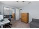 Bedroom featuring carpeted floors, closet with mirror doors, and a wooden dresser at 3853 Se 60Th St, Ocala, FL 34480