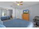 The bedroom features a closet with mirrored doors and a ceiling fan at 3853 Se 60Th St, Ocala, FL 34480