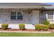 Inviting front entrance with a white door, manicured bushes, and a well-kept lawn at 3853 Se 60Th St, Ocala, FL 34480