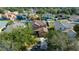 Aerial view of a two-story home with a well-manicured lawn and large driveway at 3999 Sw 51St Ct, Ocala, FL 34474