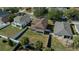 Aerial view of a two-story home showcasing the backyard and surrounding fenced yard at 3999 Sw 51St Ct, Ocala, FL 34474