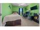 Bedroom with green walls, carpet, ceiling fan and a window for natural light at 3999 Sw 51St Ct, Ocala, FL 34474