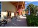 View of a clubhouse patio with picnic tables and stone pillars surrounded by lush landscaping at 3999 Sw 51St Ct, Ocala, FL 34474