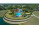 An aerial view of the community pool and recreation center with a lake view at 3999 Sw 51St Ct, Ocala, FL 34474