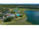 An aerial view of the community pool, recreation center, sports courts and lake at 3999 Sw 51St Ct, Ocala, FL 34474