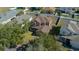 Aerial view of a two-story home featuring a well-manicured lawn and a fenced backyard at 3999 Sw 51St Ct, Ocala, FL 34474