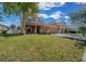 Charming two-story home with a well-manicured front yard and two-car garage at 3999 Sw 51St Ct, Ocala, FL 34474