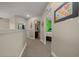 Upstairs hallway featuring carpet, access to bedrooms and a bathroom with neutral paint at 3999 Sw 51St Ct, Ocala, FL 34474