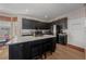 Contemporary kitchen with a functional central island and stainless steel refrigerator at 3999 Sw 51St Ct, Ocala, FL 34474