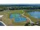 An aerial view of the community park with tennis courts and a basketball court at 3999 Sw 51St Ct, Ocala, FL 34474