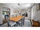 Dining room with a wooden table, pendant lighting, and an open layout at 4160 Sw 98Th St, Ocala, FL 34476