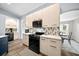 Stylish kitchen featuring sleek cabinetry, modern appliances, and an open design to the dining area at 4160 Sw 98Th St, Ocala, FL 34476