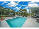 Enjoy this private screened-in pool with beautiful backyard views and ample patio seating at 4160 Sw 98Th St, Ocala, FL 34476