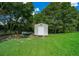 Outdoor storage shed in a lush yard at 4160 Sw 98Th St, Ocala, FL 34476