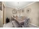 Elegant dining room featuring modern decor, a stylish chandelier, and a comfortable bench at 4555 Sw 52Nd Cir # 103, Ocala, FL 34474