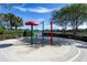 Community splash pad featuring colorful play equipment and lounge chairs for relaxation at 4555 Sw 52Nd Cir # 103, Ocala, FL 34474