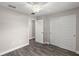 Neutral bedroom featuring a ceiling fan, wood-look flooring, and double closet at 540 Nw 64Th Pl, Ocala, FL 34475