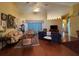 Living room with hardwood floors, neutral furniture, and a high ceiling at 5500 Nw 23Rd Pl, Ocala, FL 34482