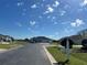 Street view of homes with mature landscaping in a well maintained neighborhood at 5500 Nw 23Rd Pl, Ocala, FL 34482