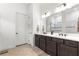 Bathroom with double vanity, framed mirror and lots of natural light at 5728 Sw 90Th Court Rd, Ocala, FL 34481